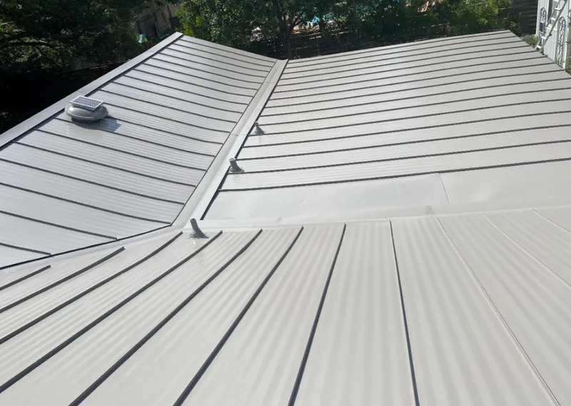 Solar attic fan installed on a metal roof for Roof Ventilation in Carrollwood